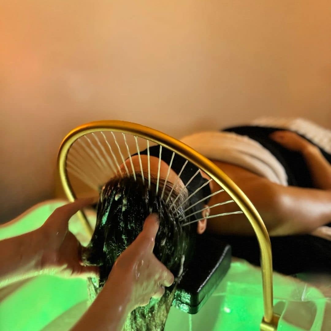 Japanese Head Spa scalp ritual with warm water rinse and gold halo basin at Freeda Body Contour Clinic, Buckhurst Hill Essex
